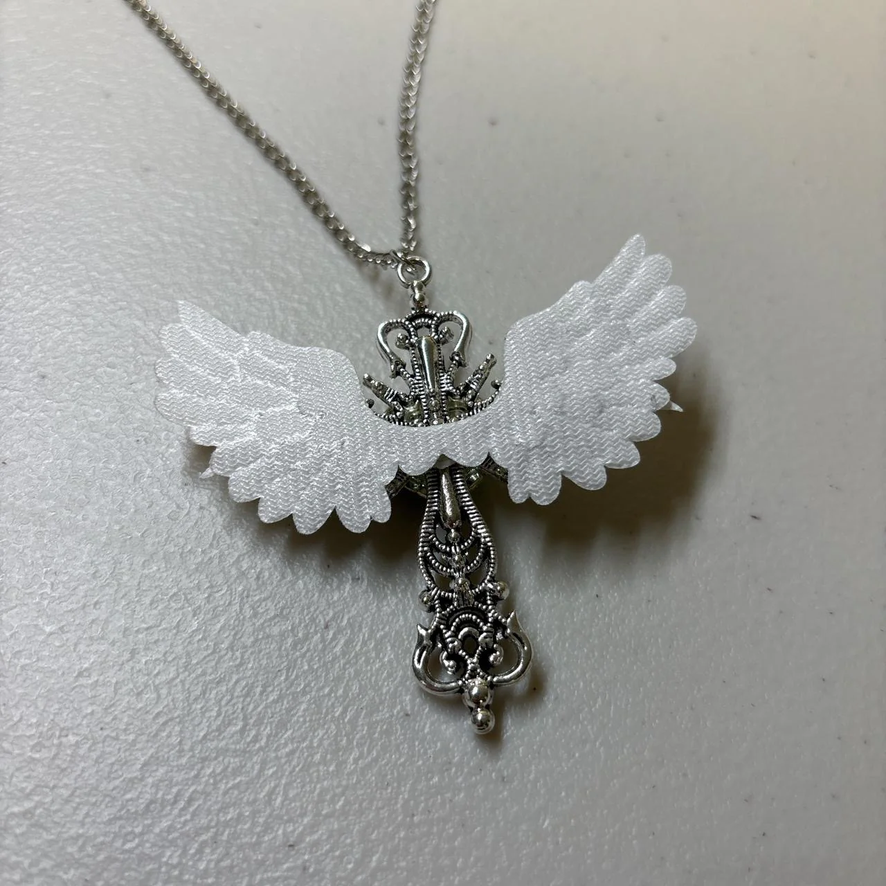Winged Cross Blue Crystal Necklace - Image 3