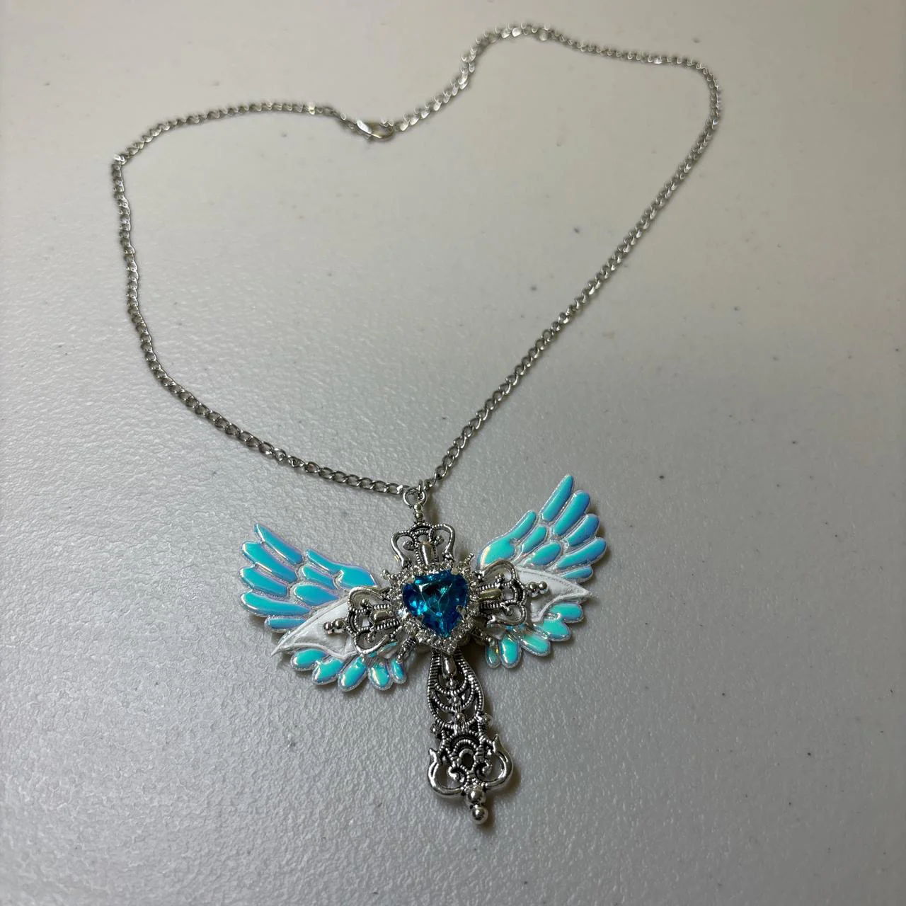 Winged Cross Blue Crystal Necklace - Image 4